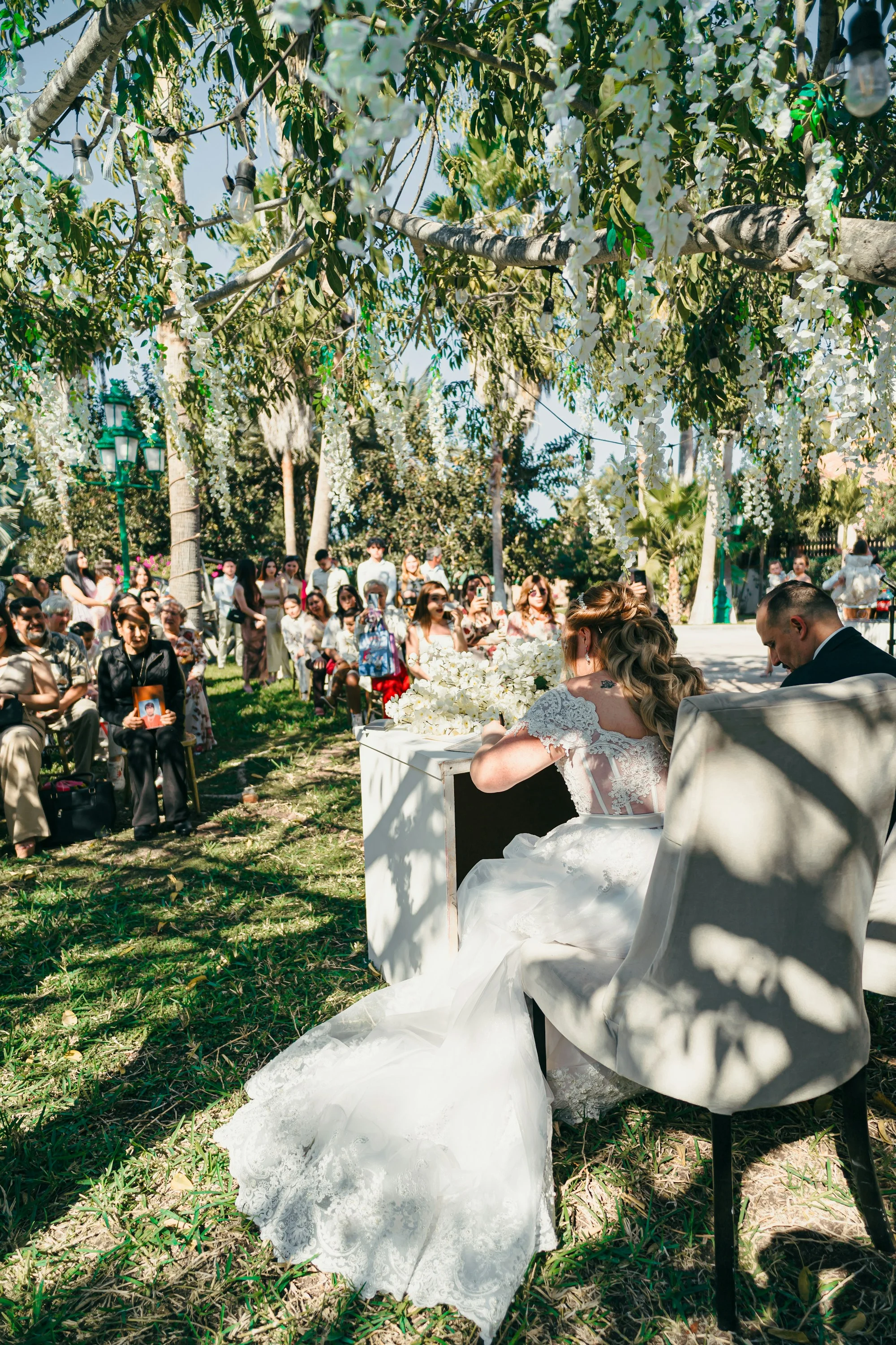 Signing the register under the trees